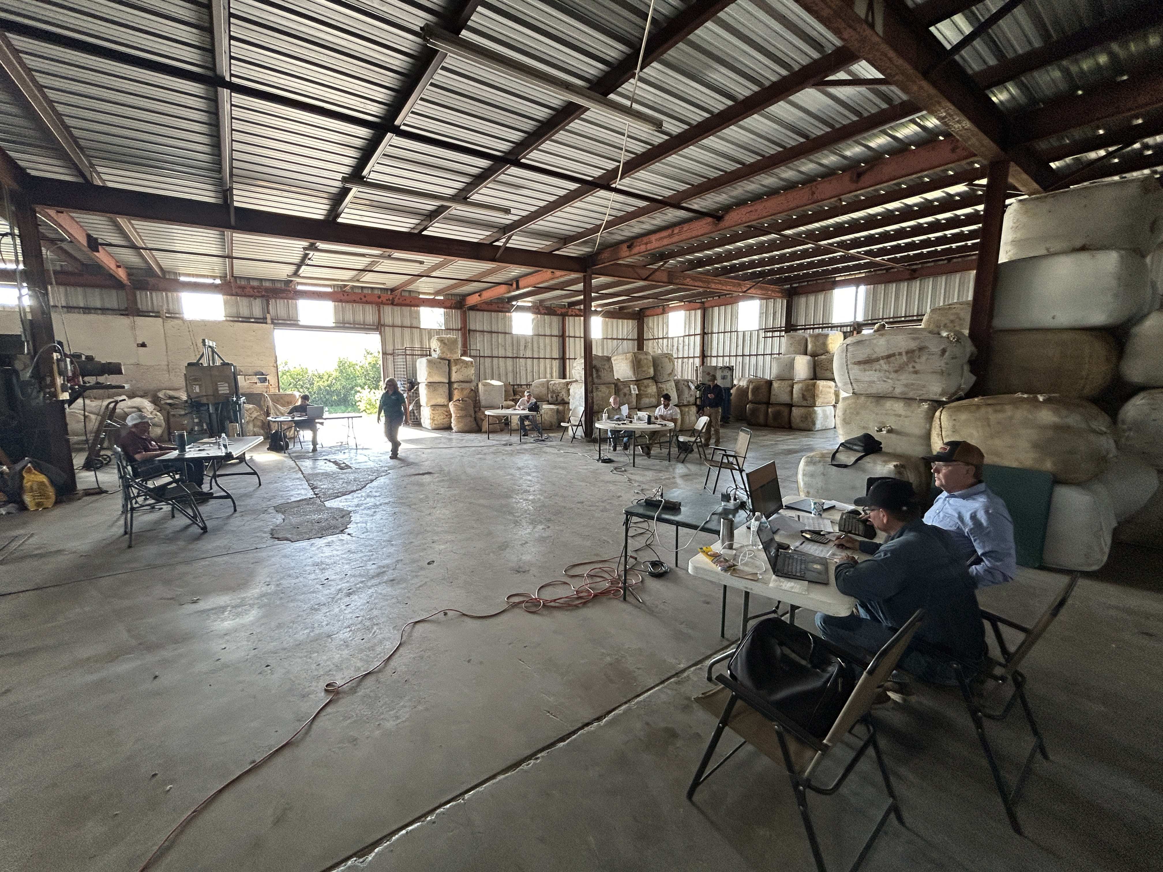 KEEN COMPETITORS, as always, these wool buyers have given themselves as much room as possible while in the bidding phase of the last wool auctions held at Bollman Industries’ warehouse in San Angelo. With the recent closings of wool warehouses in various states, the wool on hand for the May sales represented clips from across the country.